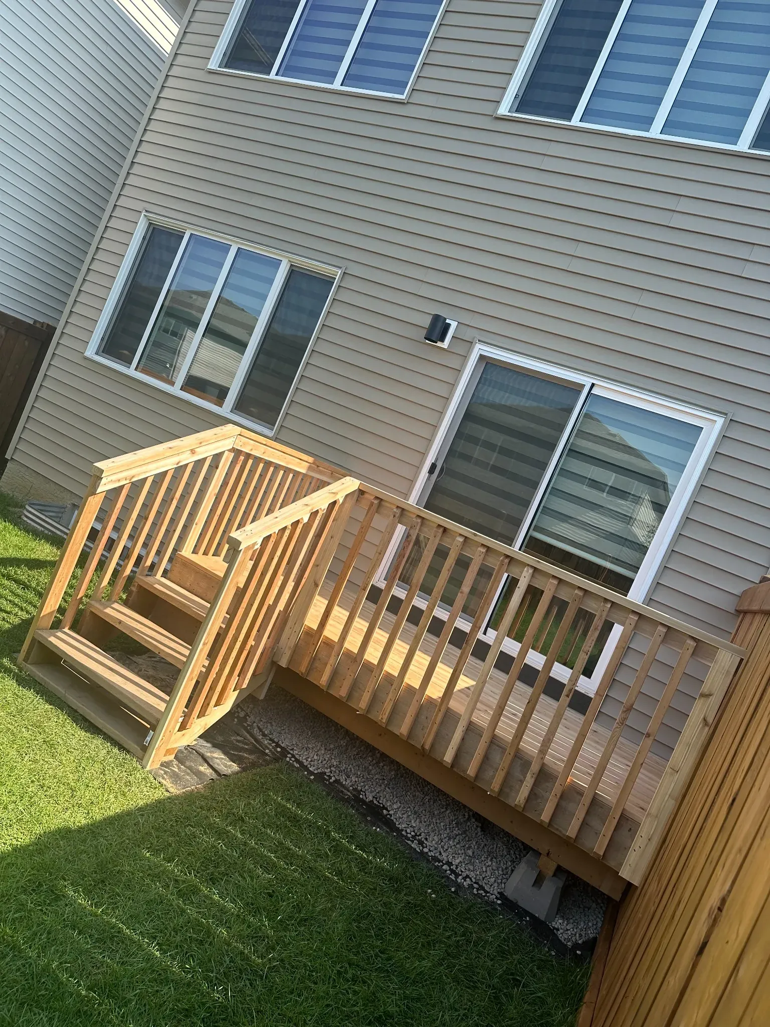 Outdoor deck with stairs and railing